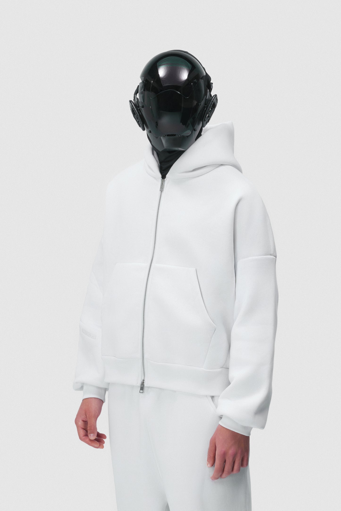THIS ZIP HOODIE SLIPS ON QUIET AND LEAVES A MARK.