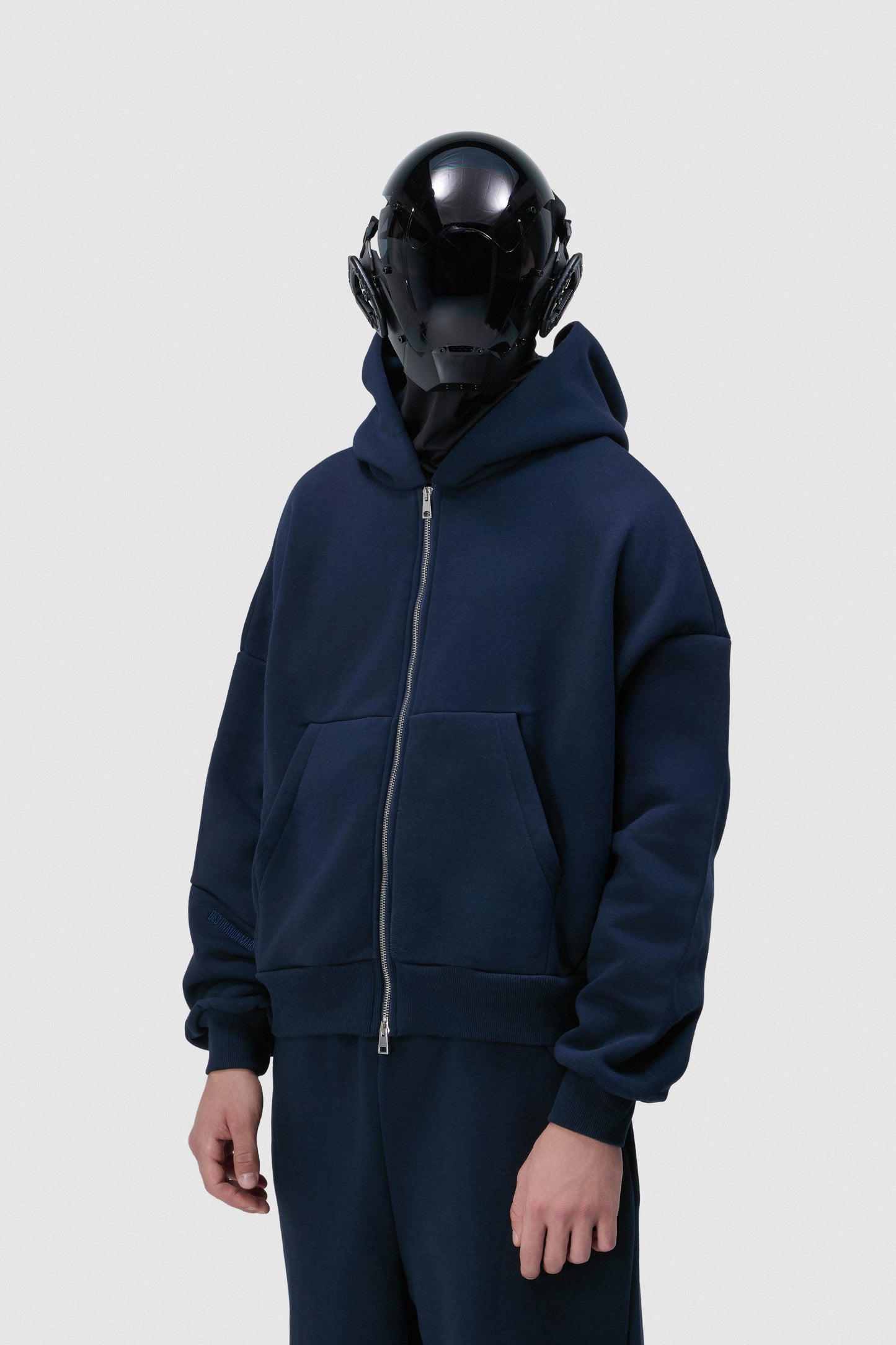 THIS ZIP HOODIE SLIPS ON QUIET AND LEAVES A MARK.