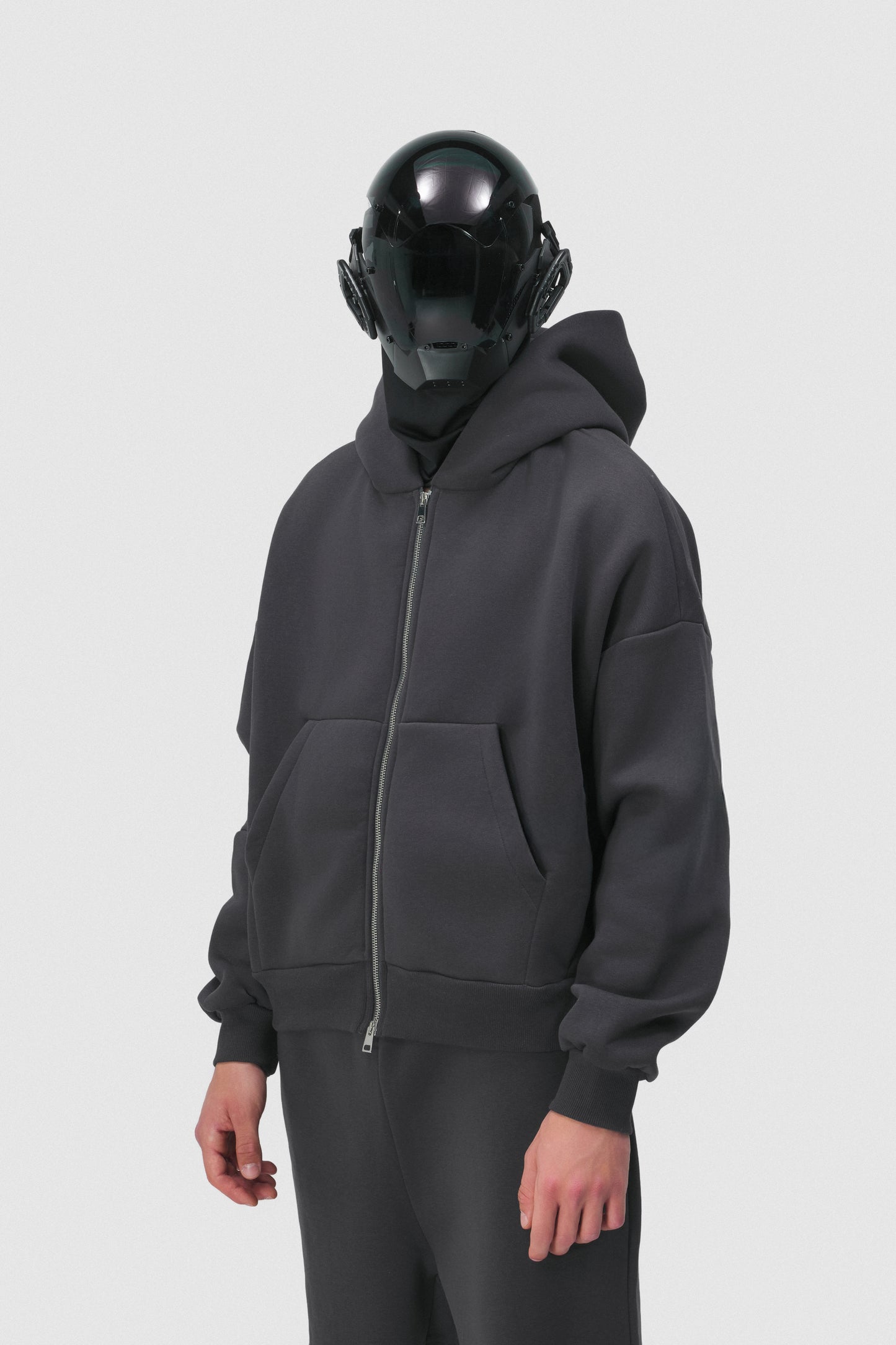 THIS ZIP HOODIE SLIPS ON QUIET AND LEAVES A MARK.