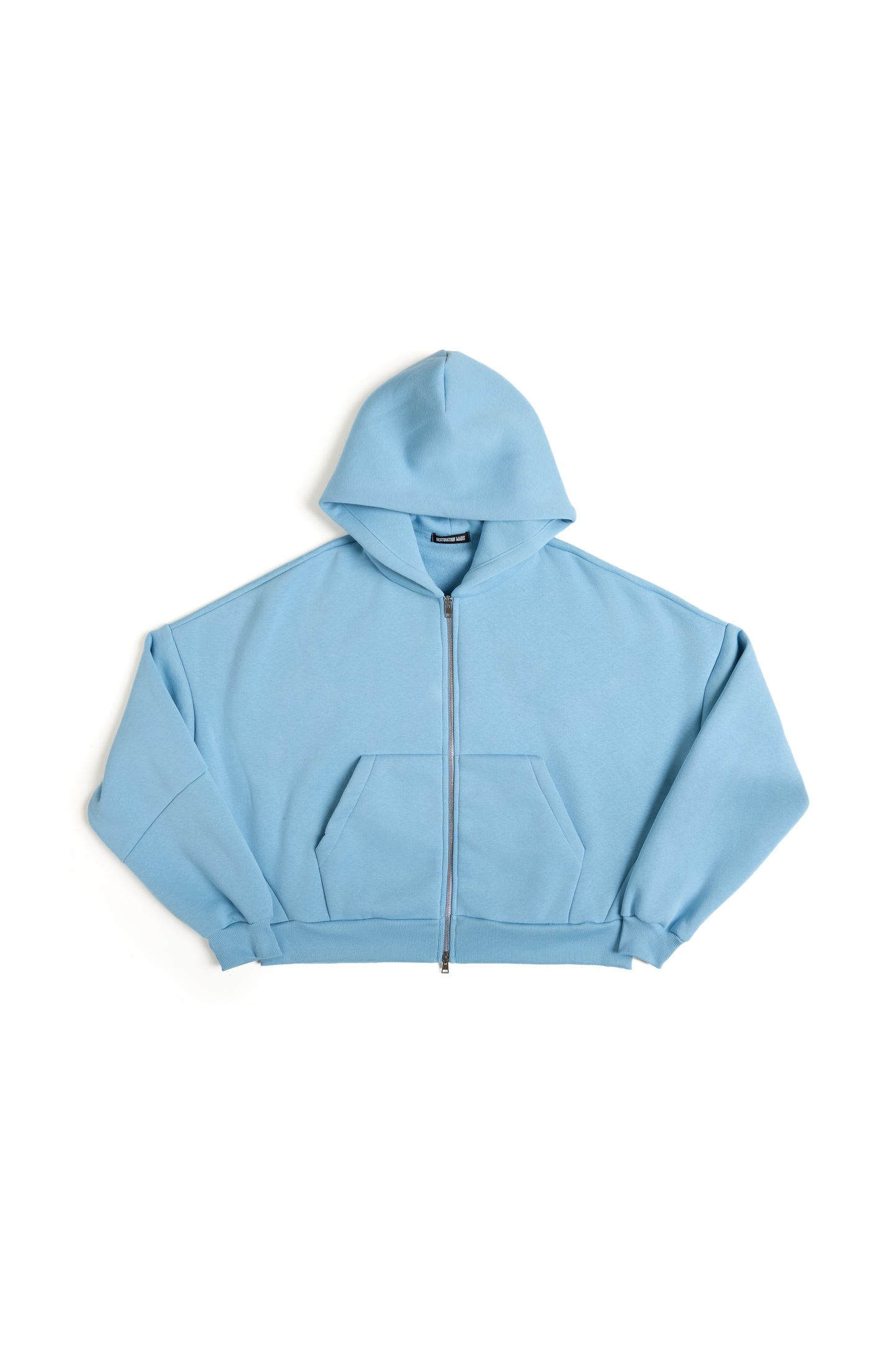 THIS ZIP HOODIE SLIPS ON QUIET AND LEAVES A MARK.