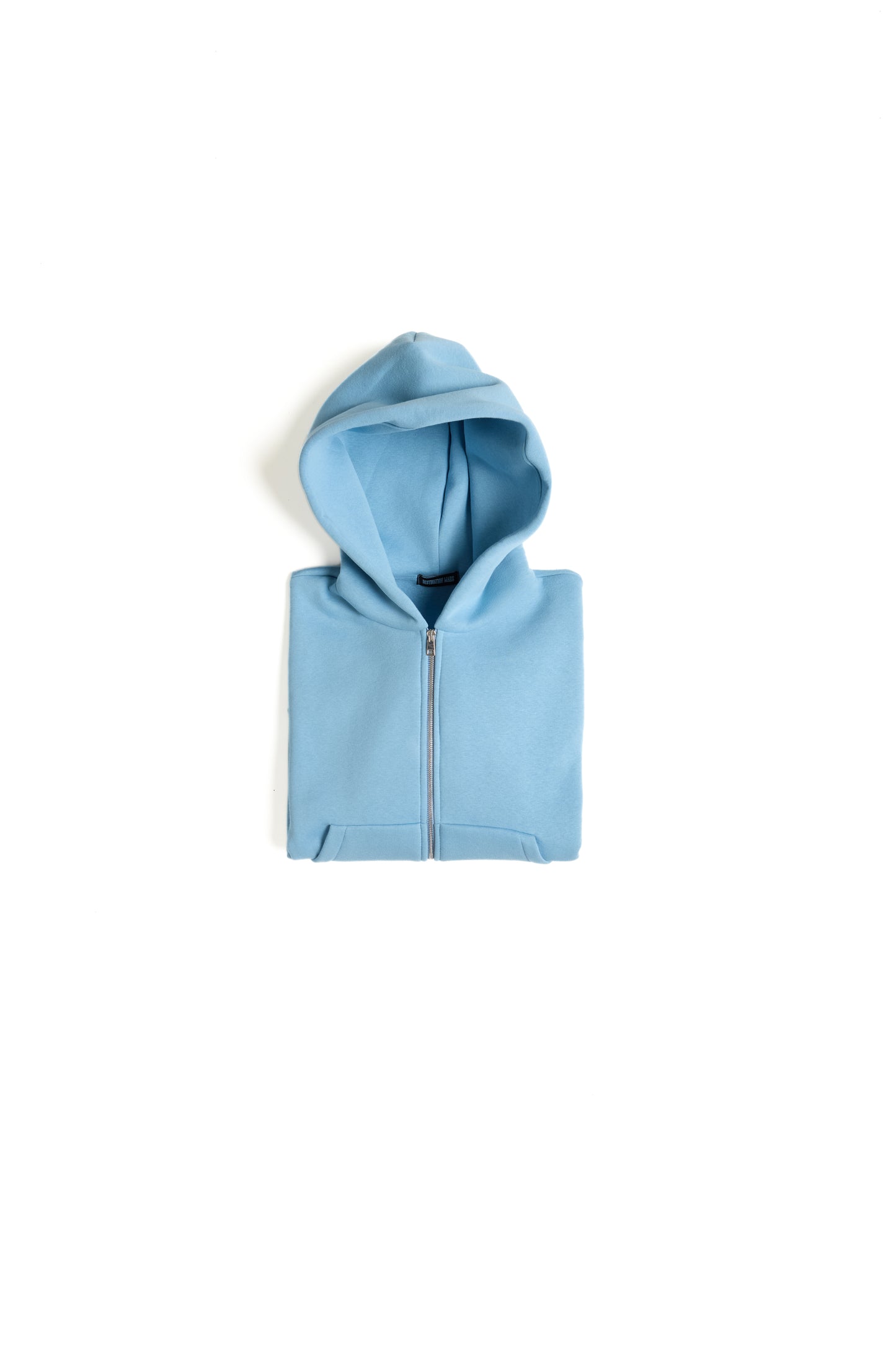 THIS ZIP HOODIE SLIPS ON QUIET AND LEAVES A MARK.