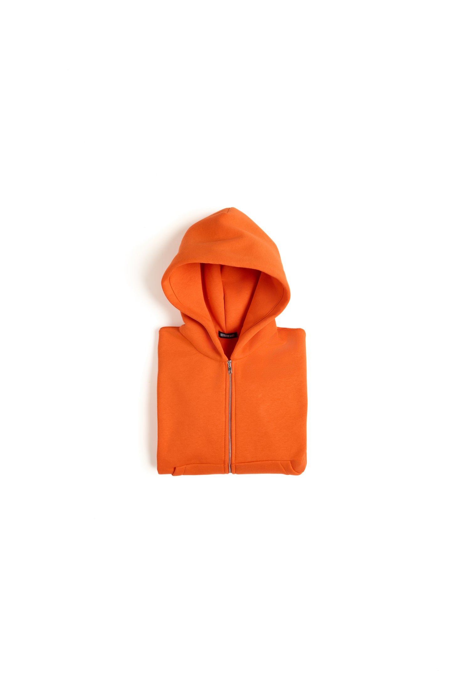 THIS ZIP HOODIE SLIPS ON QUIET AND LEAVES A MARK.