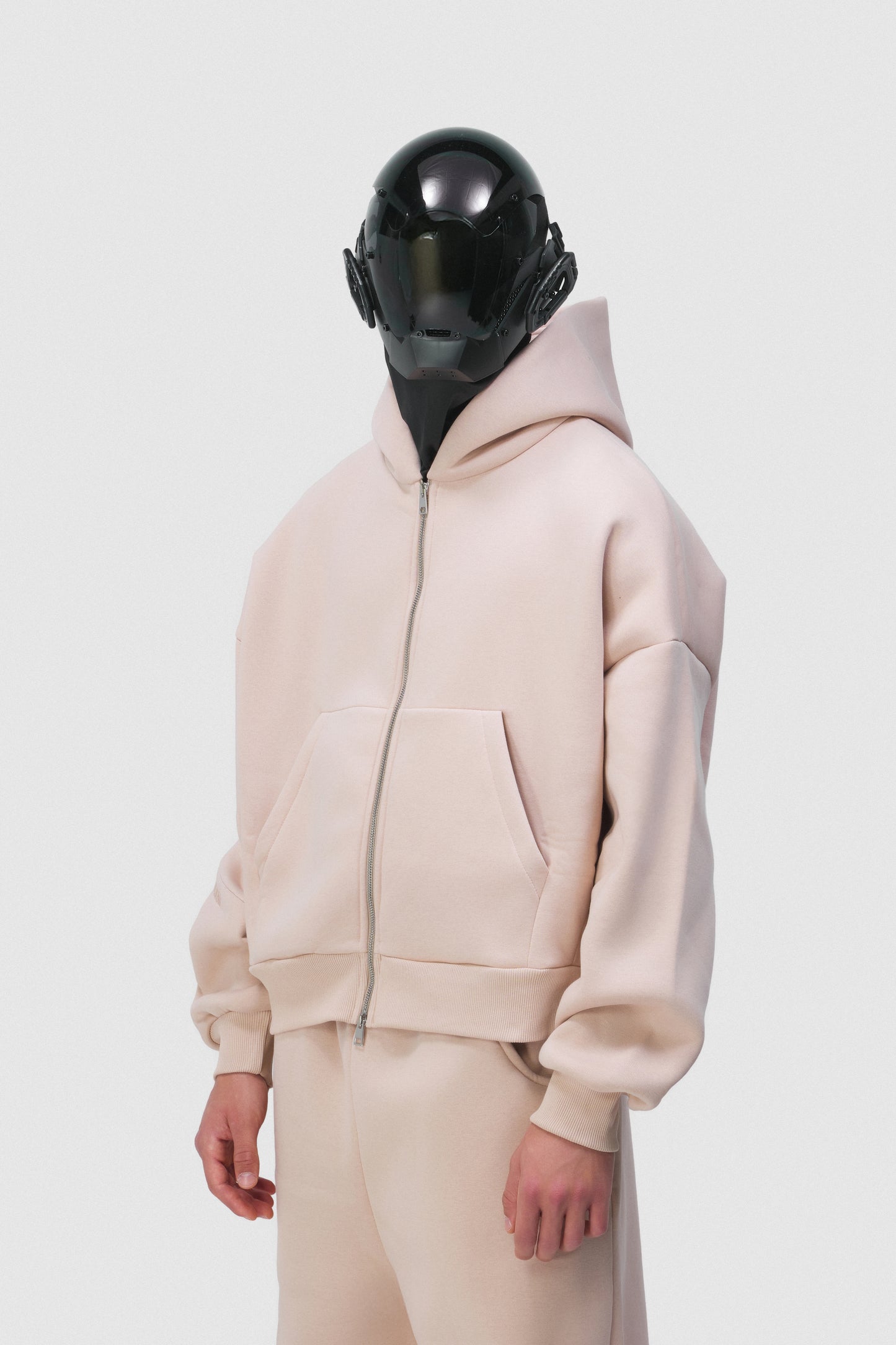 THIS ZIP HOODIE SLIPS ON QUIET AND LEAVES A MARK.