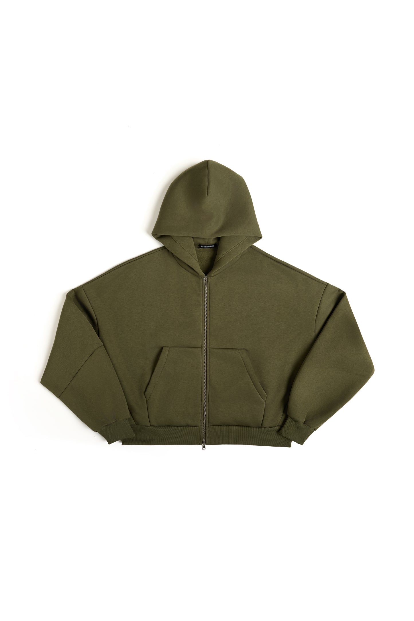 THIS ZIP HOODIE SLIPS ON QUIET AND LEAVES A MARK.