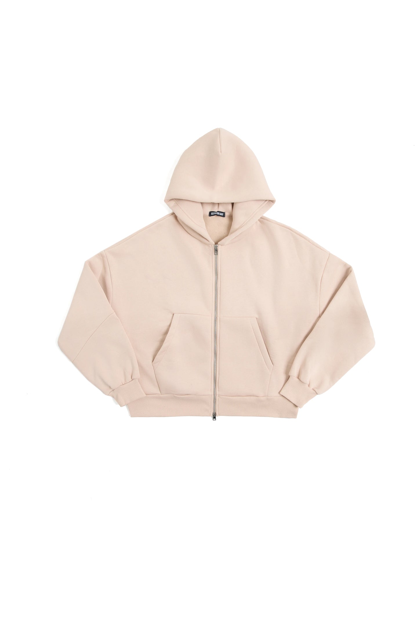 THIS ZIP HOODIE SLIPS ON QUIET AND LEAVES A MARK.