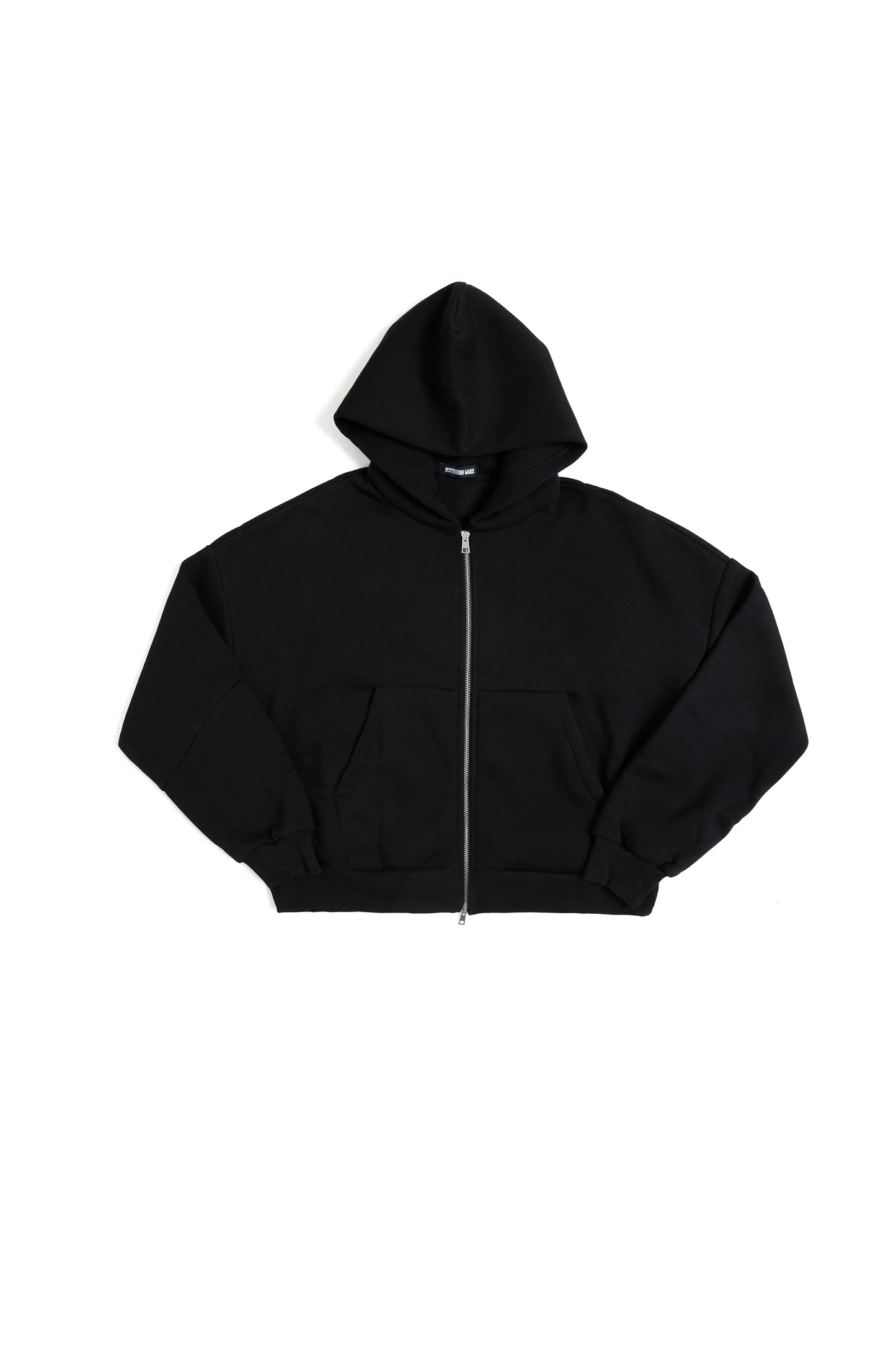 THIS ZIP HOODIE SLIPS ON QUIET AND LEAVES A MARK.