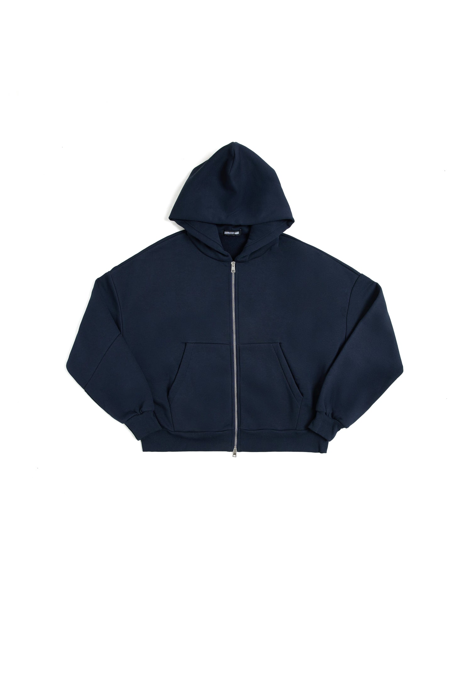 THIS ZIP HOODIE SLIPS ON QUIET AND LEAVES A MARK.