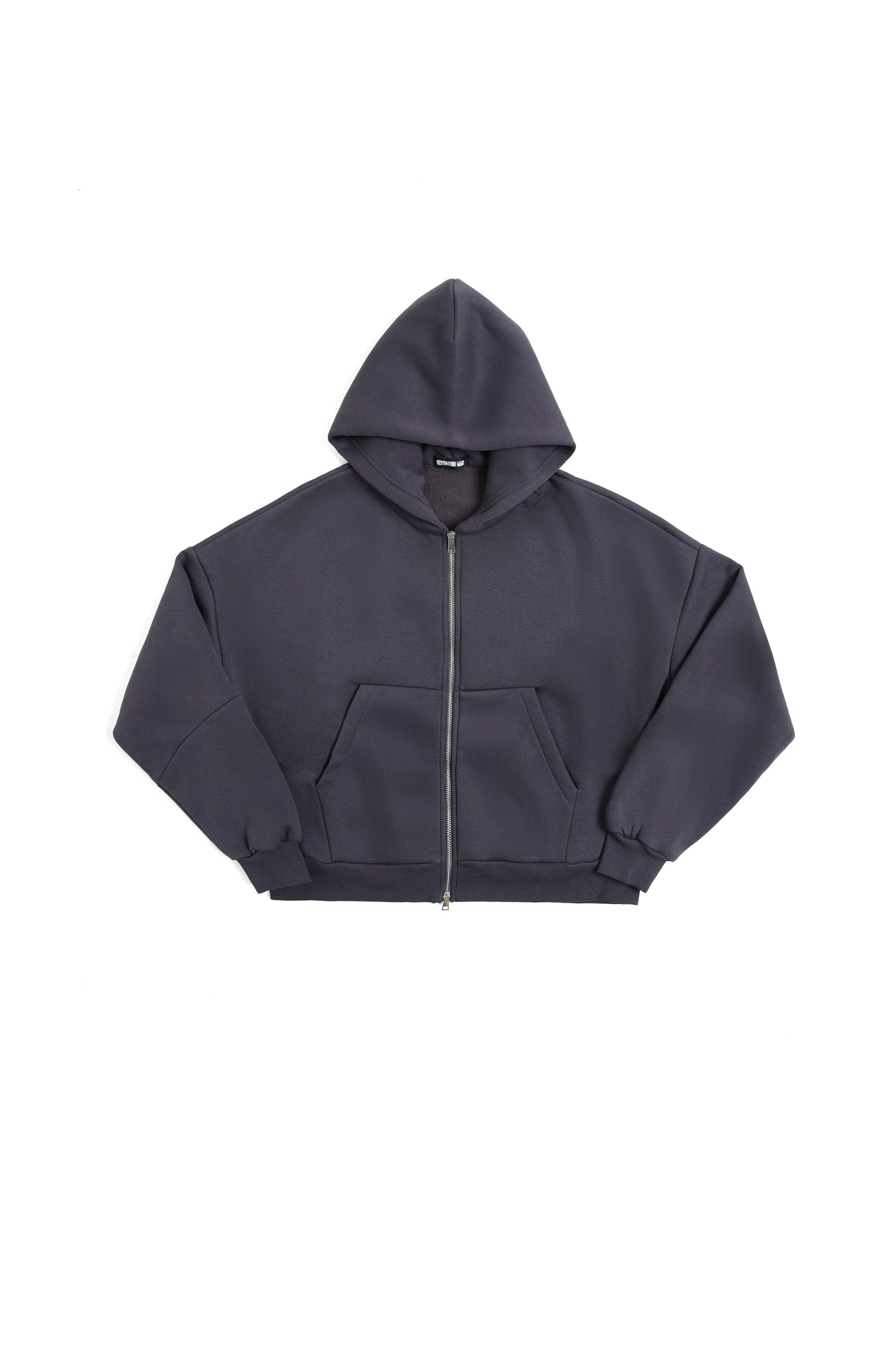 THIS ZIP HOODIE SLIPS ON QUIET AND LEAVES A MARK.
